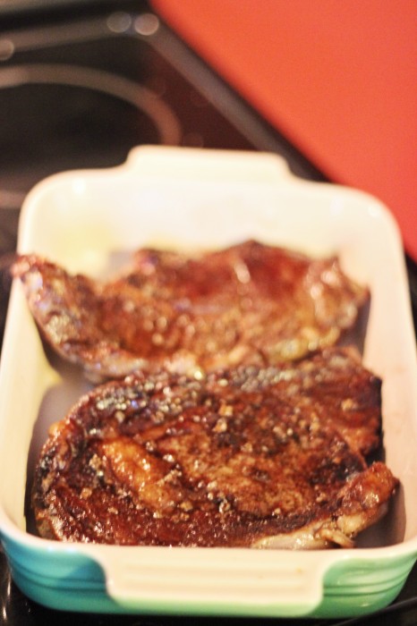 seared chuck eye steaks ready to place in the oven