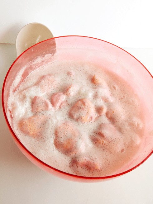 This pink party punch with sherbet is the perfect punch for baby showers or Valentine's day! 