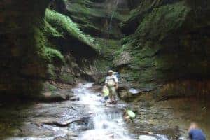 hiking with baby on nature trail with waterfall