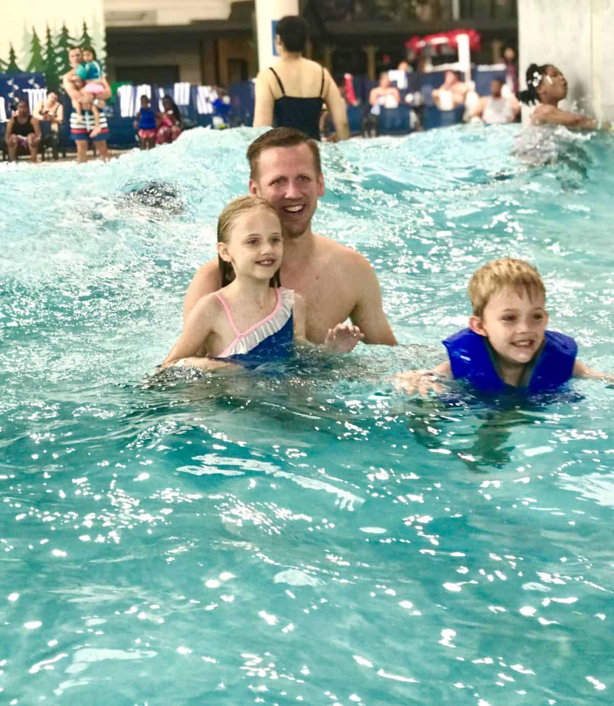 Great wolf lodge family in wave pool