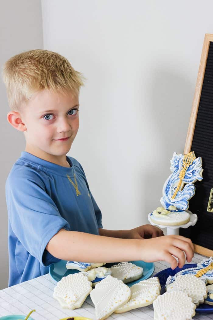 child choosing an ocean themed cookie