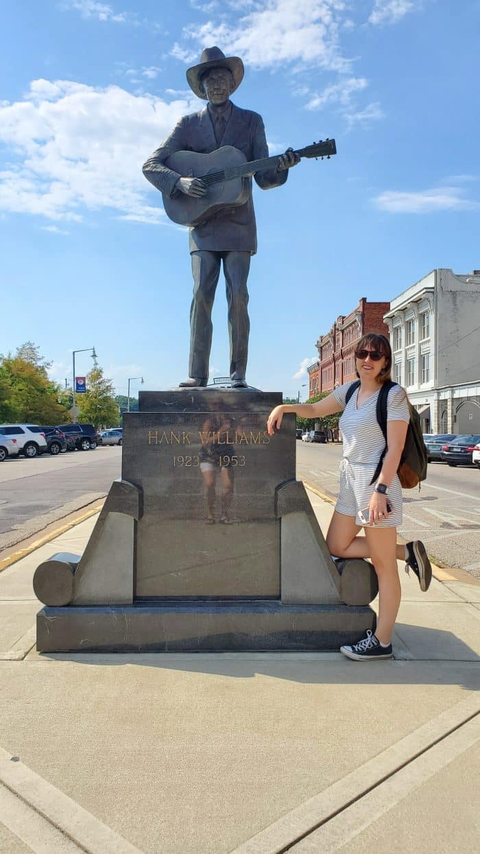 posing with the hank williams statue montgomery, alabama riverwalk