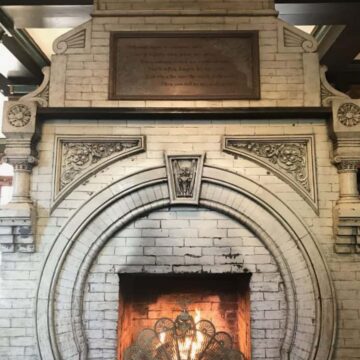 the antique original fireplace inside the lobby of the crescent hotel.