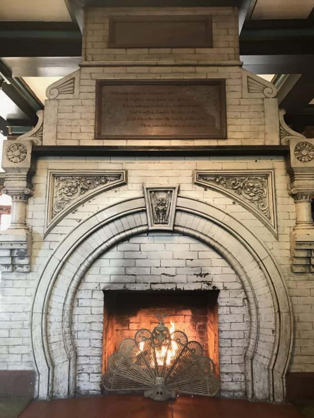 the antique original fireplace inside the lobby of the crescent hotel.