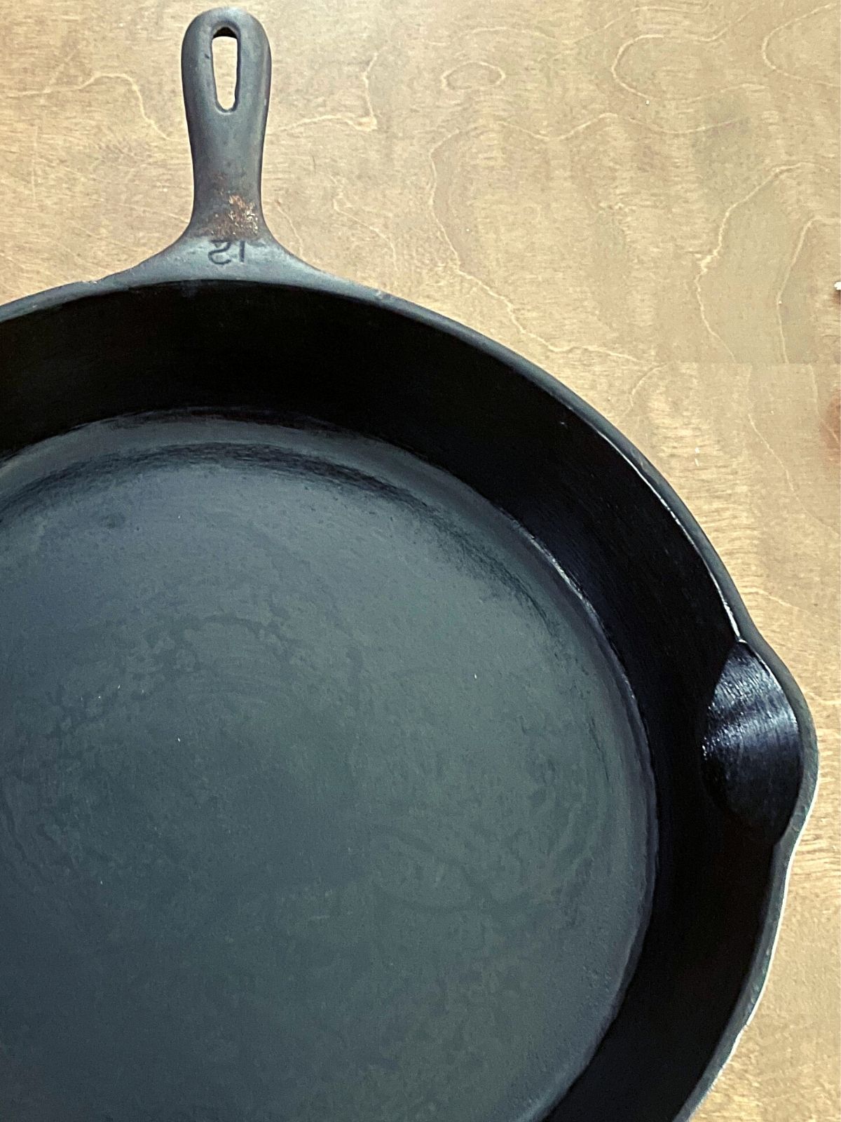 large cast iron skillet that is over 100 years old.