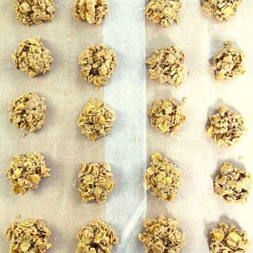 cornflake cookies cooling on wax paper.