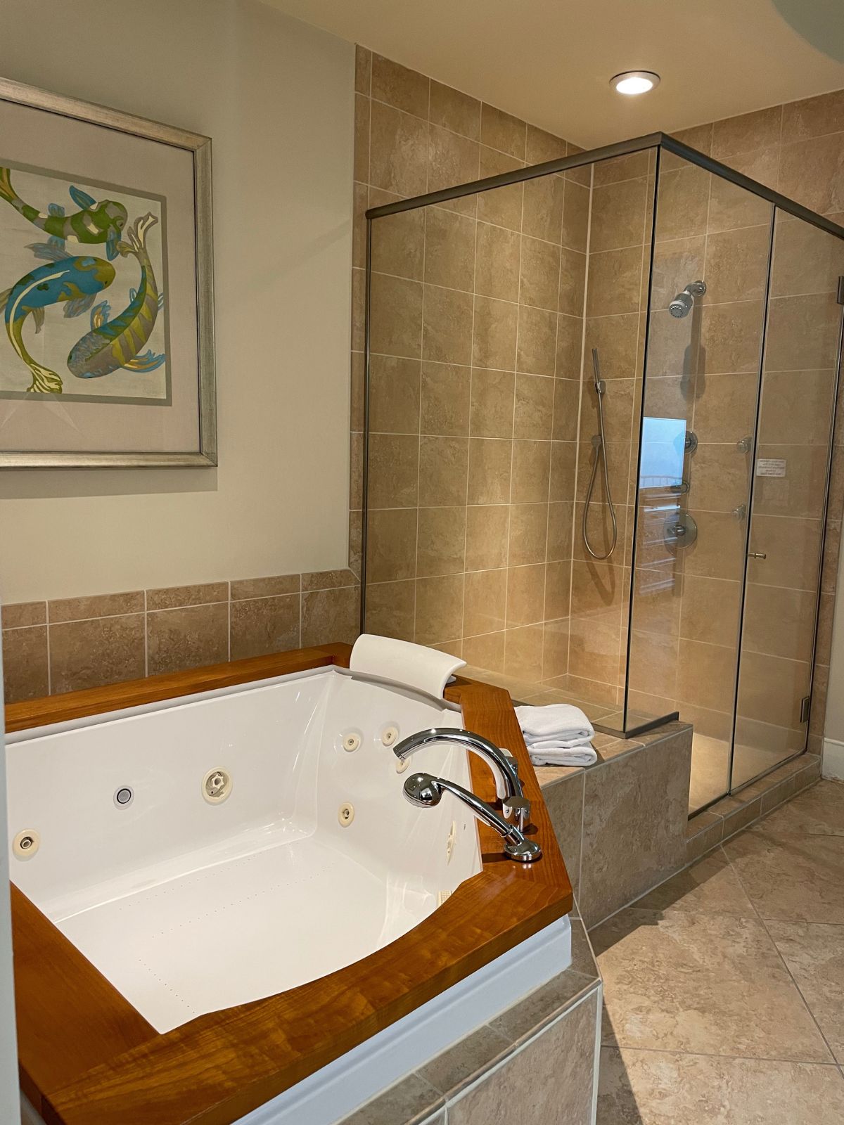 Master bathroom at Turquoise Place with Jacuzzi tub and shower stall.