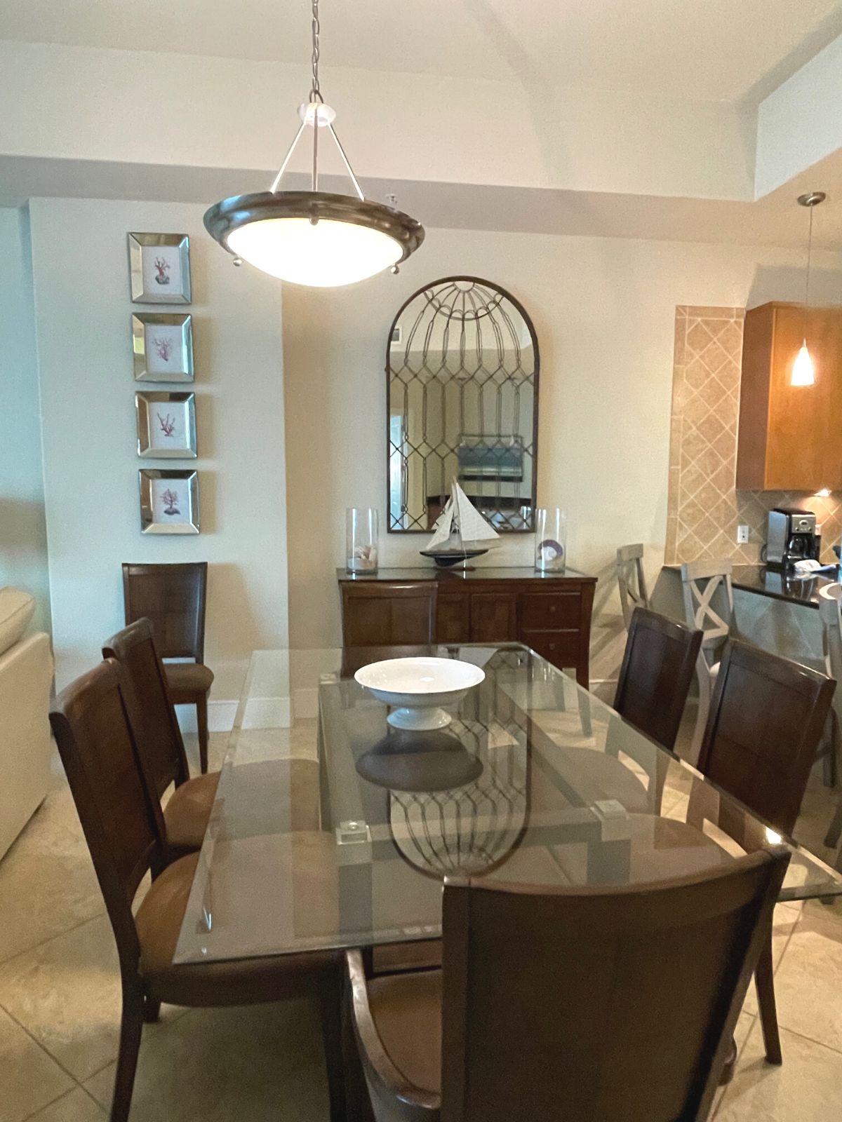 Dining room table and chairs at turquoise place.