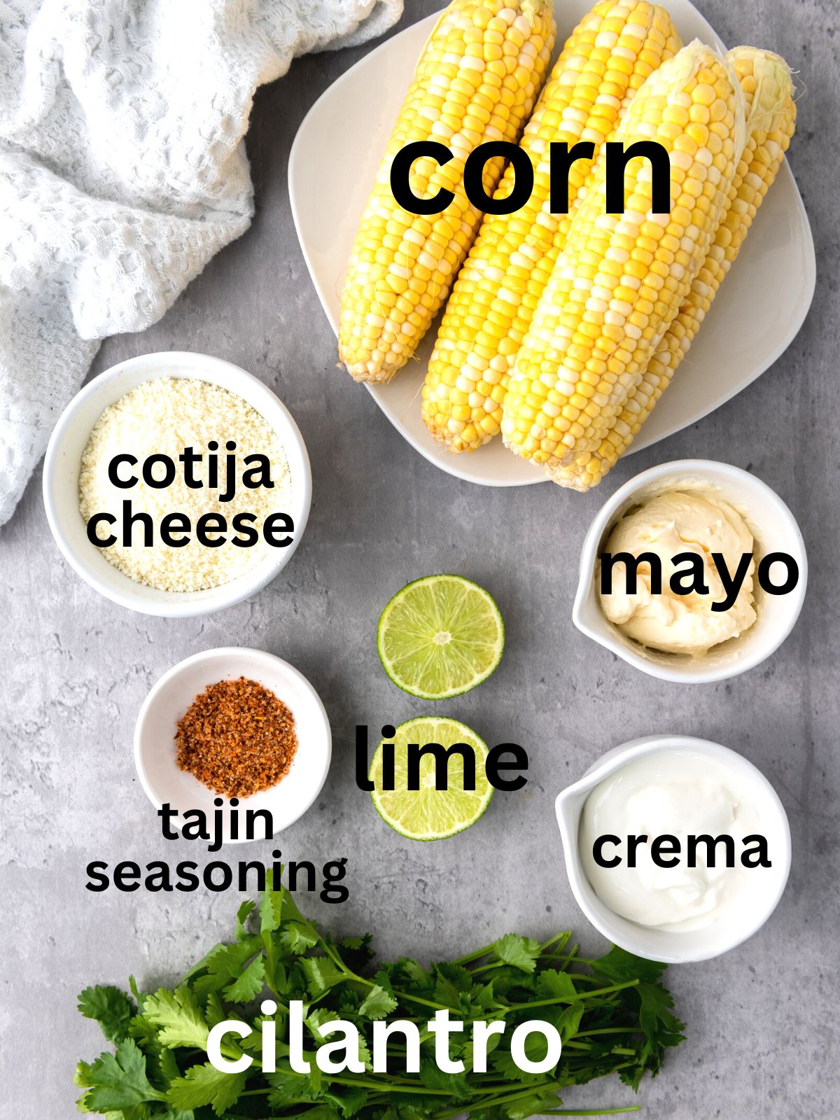 Elote ingredients: cotija, corn, mayo, tajin, lime, cilantro, and crema.